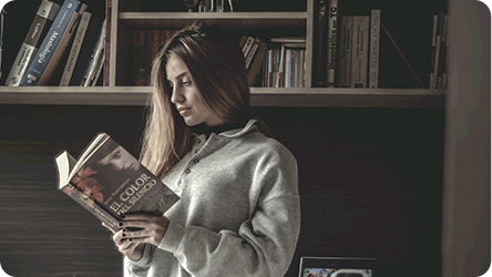 A model posing with a book