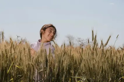 Similing girl in a grain field in Portugal